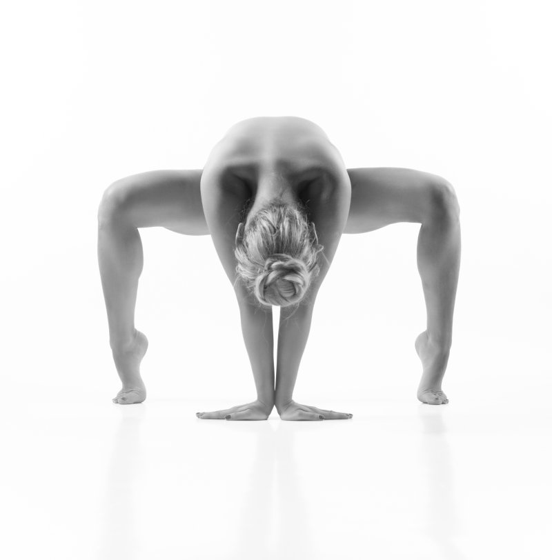Woman performing a yoga pose in studio